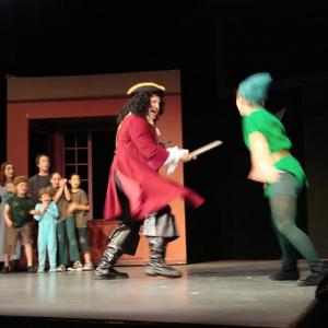 Roger Rignack as Captain Hook sword fighting Peter Pan
