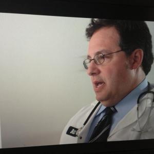 Production shot from the film, Conviction. Roger Rignack as Dr. Crouch.