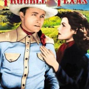 Rita Hayworth and Tex Ritter in Trouble in Texas (1937)