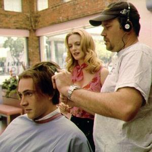 Director James B Rogers shows Heather Graham how to give a bad haircut