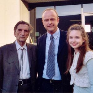 Harry Dean Stanton Andrew A Rolfes and Daveigh Chase on the set of the HBO series Big Love