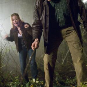 Still of Brenda James and Michael Rooker in Slither 2006