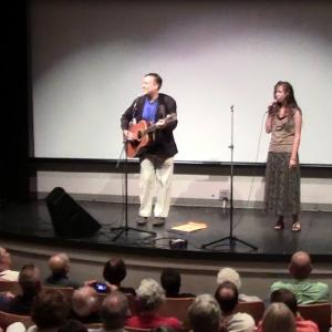Richard Rossi performing the Clemente movie theme song with Lisa Sobek before soldout crowd in Pittsburgh at Strand Theater for premiere of his film Baseballs Last Hero 21 Clemente Stories Photo taken on August 18 2013 Clementes birthday