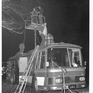 Don Schain (Director) and crew members atop Cinemobile on shooting of 