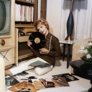 Barbara Rush at home listening to her Frank Sinatra record albums