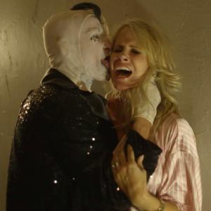 Screen grab of Bill Oberst Jr as Papa Corn and Chanel Ryan as Tiffany in Circus Of The Dead