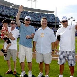 Quinn and David Salzberg far left at Dodger Stadium for the 4th of July event honoring The Perfect Game Movie with C Tureaud Producer and Coaches During Production of the Film
