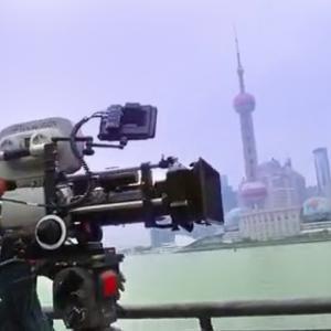 Director Rian Johnson sets up a shot on the famous Bund boardwalk in Shanghai China for his SciFi hit Looper