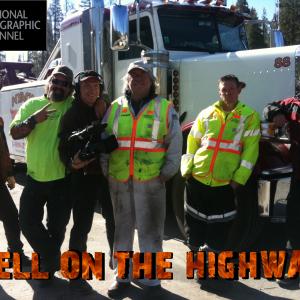 Producer Craig Santy has a lighthearted moment with the cast from Nyack Towing on the set of the National Geographic Channels Hell On The Highway
