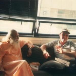 Sri Swami Satchidananda meeting with Academy Award winning ProducerDirector Oliver Stone in his Santa Monica Offices 1998