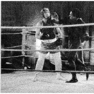 Rodney (Carl the Boxer)hits actor Judd Hirsch (Alex) with a vicious over hand right in a scene from the hit comedy 