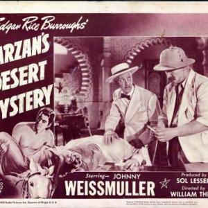 Otto Kruger Joe Sawyer and Johnny Weissmuller in Tarzans Desert Mystery 1943