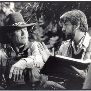writer-director David Schmoeller and actor Chuck Connors on the set of TOURIST TRAP, 1978, Los Angeles