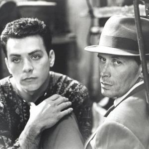 Joseph Scorsiani as Kiki and Peter Weller as Bill Lee in Naked Lunch1991