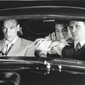 Julian Sands as Yves Cloquet, Joseph Scorsiani¹ as Kiki, and Peter Weller as Bill Lee in Naked Lunch(1991)