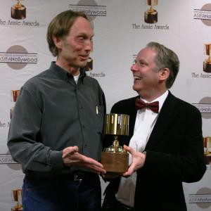 Presenter Henry Selick congratulates Nick Park on his Ub Iwerks award
