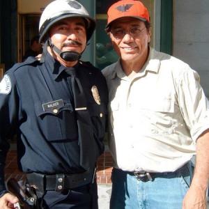 LOS ANGELES  JULY 31 Actorcharacter Alexander Sibaja as a Metropolitan Los Angeles Motorcycle Police Officer and directoractor Edward James Olmos pose as they are seen filming on HBO film Walkout on July 31 2005 at City Hall in Los Angeles California