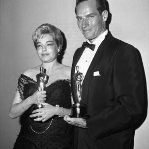 Best Actress Simone Signoret Room at the Top and Best Actor Charlton Heston BenHur at the 32nd Academy Awards
