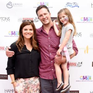 Tiffani Thiessen, Brady Smith and Harper Renn Smith attend the CMEE 6th Annual Family Fair at Children's Museum of the East End on July 19, 2014 in Bridgehampton, New York.