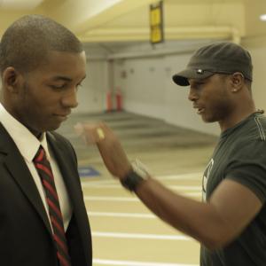 Eric Smith-Gunn gives support to Darren Thomas on the set of the film 
