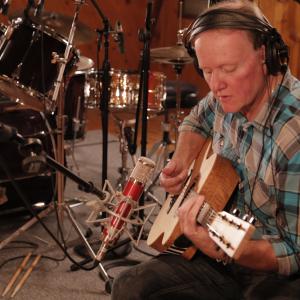 Performing in the studio, on the album Dust Bowl