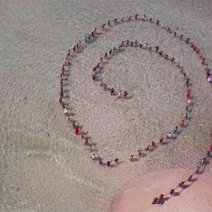 Reef Summit 2010 Belize. 400 Belizians out on a reef with Darryl Hannah forming a message to the world, Harmony (Artist: John Quigley)