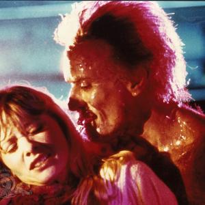 Still of Barbara Crampton and Ted Sorel in From Beyond 1986