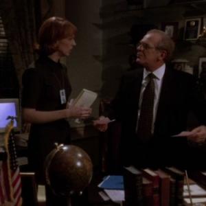 Still of NiCole Robinson and John Spencer in The West Wing 1999