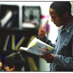 Ezra J. Stanley reads children's literature to fourth grade classes as part of the Screen Actors Guild BookPALS volunteer program.