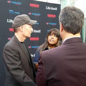 Stephen Stanton Chaz Ebert ABC 7s George Pennacchio on the red carpet at the Life Itself Los Angeles Premiere 2014