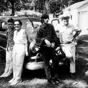 Ringo Starr in Ozarks, Arakansas posing on by a family, c. 1965