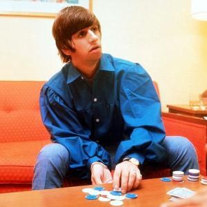 Ringo Starr collecting his chips in a card game, 1964