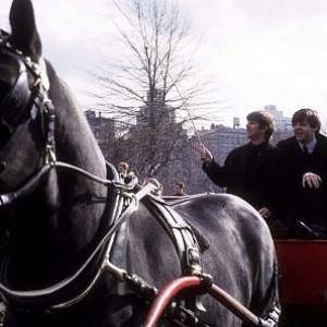 The Beatles ( Ringo Starr, Paul McCartney, John Lennon on a horse carriage ride)