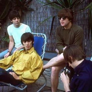 The Beatles  Paul McCartney George Harrison John Lennon Ringo Starr along the poolside Ringo plays around with his camera 1964