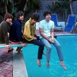 The Beatles (John Lennon, Ringo Starr, George Harrison, Paul McCartney on the diving board by the poolside)