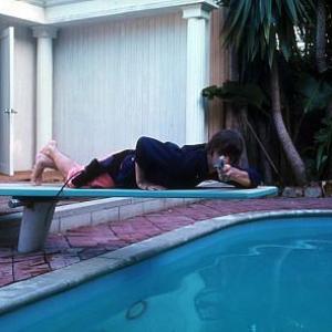 The Beatles  Ringo Starr lies belly position on the diving board while pointing his gun