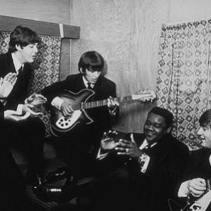 The Beatles (Ringo Starr, Paul McCartney, George Harrison, and John Lennon) with Fats Domino c. 1964