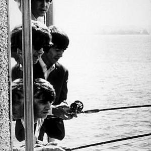 The Beatles  Paul McCartney John Lennon George Harrison Ringo Starr fishing outside a window in Seattle Wa 1964