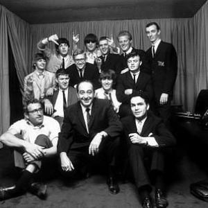 The Beatles Ringo Starr Paul McCartney John Lennon and George Harrison in a group picture with Management c 1964