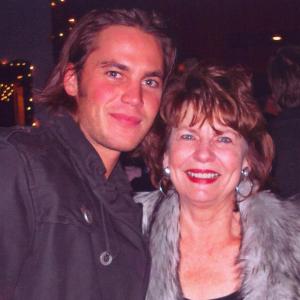 With actor Taylor Kitsch at a cast party for FRIDAY NIGHT LIGHTS