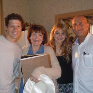 On the set of FRIDAY NIGHT LIGHTS with actors Zach Gilford and Aimee Teegarden and director Michael Waxman