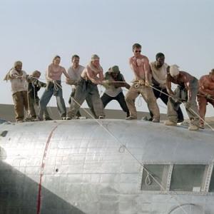The survivors of a downed aircraft pull together to build a new plane out of the wreckage of the old one L to R Jacob Vargas Giovanni Ribisi Miranda Otto Hugh Laurie Scott Michael Campbell Kevork Malikyan Dennis Quaid Tyrese Gibson Kirk Jones and Tony Curran
