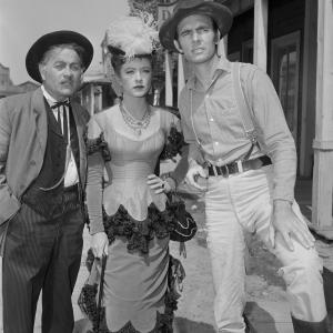 Still of Amanda Blake Ken Curtis Milburn Stone and Dennis Weaver in Gunsmoke 1955