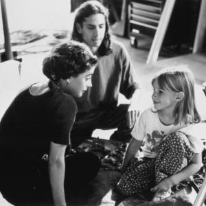 Still of Julia Devin Moira Kelly and Wesley Strick in The Tie That Binds 1995
