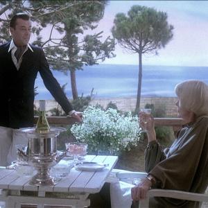 Still of Dirk Bogarde and Elaine Stritch in Providence (1977)