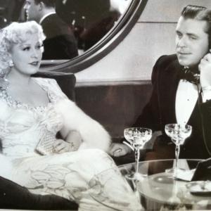 Mae West and Lyle Talbot in a scene from 