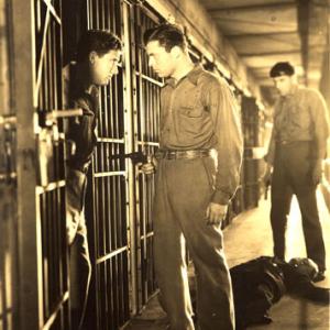 Lyle Talbot (with gun) and Spencer Tracy during prison break scene in 