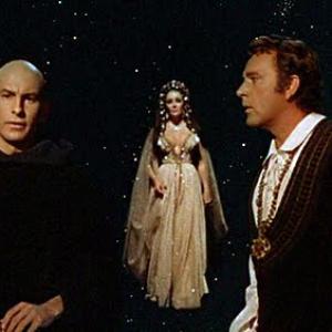 Andreas Teuber as Mephistopheles Elizabeth Taylor as Helen of Troy and Richard Burton as Faustus in the film version of DR FAUSTUS