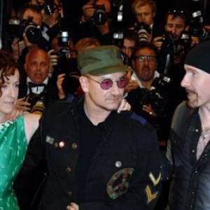 Bono, The Edge and Catherine Owens at event of U2 3D (2007)