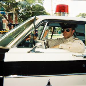 Bookum DanO Playing the role of Pelletier the local cop On the set of The Garage in Lockhart Tx